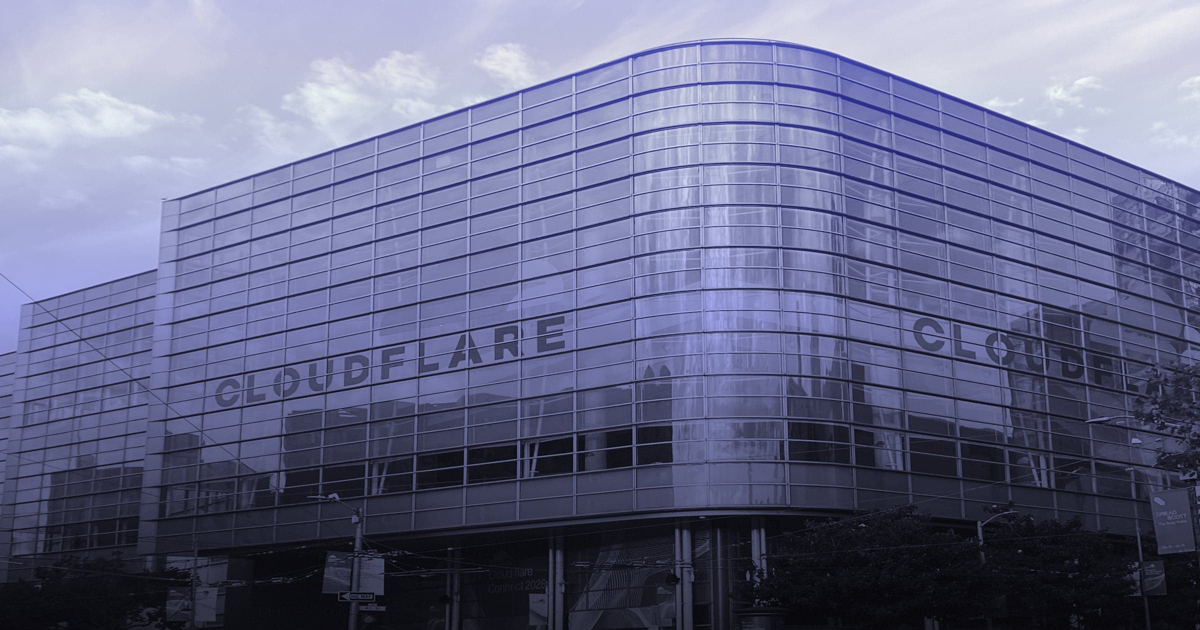 Moscone West in San Francisco with Cloudflare branding on its glass facade during Cloudflare Connect 2026